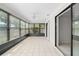 A beautiful sun room with tiled floors and multiple windows for natural lighting and backyard views at 314 Oak Hill Way # 24, Sarasota, FL 34232