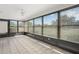 A beautiful sun room with tiled floors and multiple windows for natural lighting and backyard views at 314 Oak Hill Way # 24, Sarasota, FL 34232