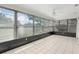 A beautiful sun room with tiled floors and multiple windows for natural lighting and backyard views at 314 Oak Hill Way # 24, Sarasota, FL 34232