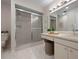 Well-lit bathroom with a glass-enclosed shower, vanity area, offering a serene and functional space at 3360 Tallywood Ct # 7082, Sarasota, FL 34237