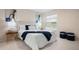 Well-lit bedroom with a plush bed, cozy seating, and stylish decorative accents at 3360 Tallywood Ct # 7082, Sarasota, FL 34237