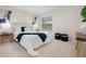 Comfortable bedroom with plush carpeting and large window bringing in natural light at 3360 Tallywood Ct # 7082, Sarasota, FL 34237