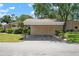 Convenient carport parking with storage rooms, surrounded by green landscaping at 3360 Tallywood Ct # 7082, Sarasota, FL 34237