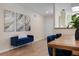 Inviting dining area with wood table, plush seating, and elegant wall decor at 3360 Tallywood Ct # 7082, Sarasota, FL 34237
