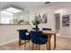 Comfortable dining space with stylish decor open to the kitchen area at 3360 Tallywood Ct # 7082, Sarasota, FL 34237