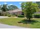Charming single-story home featuring a well-manicured lawn and mature trees at 3360 Tallywood Ct # 7082, Sarasota, FL 34237