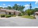 Inviting exterior view with lush landscaping and convenient parking at 3360 Tallywood Ct # 7082, Sarasota, FL 34237