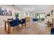 Open-concept living and dining area with stylish furnishings and wood flooring at 3360 Tallywood Ct # 7082, Sarasota, FL 34237