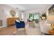 Bright living area featuring neutral walls, modern furniture, and sliding glass doors at 3360 Tallywood Ct # 7082, Sarasota, FL 34237