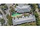 Overhead view showcasing a community pool, well-maintained landscaping, and gray roofing at 3405 54Th W Dr # 102, Bradenton, FL 34210