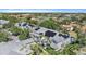 Beautiful aerial view of the home with solar panels and lush landscaping in a well-maintained community at 3405 54Th W Dr # 102, Bradenton, FL 34210