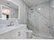 Luxurious bathroom features a glass enclosed shower with marble accents, a vanity, and modern fixtures at 3405 54Th W Dr # 102, Bradenton, FL 34210