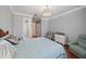 Comfortable bedroom features natural light, a soft color palette, and hardwood floors creating a serene atmosphere at 3405 54Th W Dr # 102, Bradenton, FL 34210