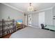 This bedroom features hardwood floors and light fixture at 3405 54Th W Dr # 102, Bradenton, FL 34210