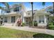Charming two-story home featuring a well-manicured lawn and tropical landscaping, with a welcoming front entrance at 3405 54Th W Dr # 102, Bradenton, FL 34210