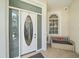 Covered front porch featuring tile flooring, decor, and secure doorway at 3405 54Th W Dr # 102, Bradenton, FL 34210