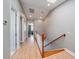 Second floor hallway featuring wood floors, natural light and doors to multiple rooms at 3405 54Th W Dr # 102, Bradenton, FL 34210