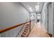 Bright hallway with wood floors, natural light from skylights, and doorways to rooms at 3405 54Th W Dr # 102, Bradenton, FL 34210