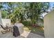 Private outdoor patio with seating, a grill, and tropical landscaping for relaxed outdoor living at 3405 54Th W Dr # 102, Bradenton, FL 34210
