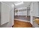 Organized walk-in closet with wooden floors and ample shelving and rack space at 3405 54Th W Dr # 102, Bradenton, FL 34210