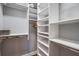 Walk-in closet providing ample storage with shelves and racks at 3405 54Th W Dr # 102, Bradenton, FL 34210
