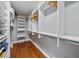 Large walk-in closet with custom shelving and storage solutions at 3405 54Th W Dr # 102, Bradenton, FL 34210