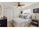 Comfortable bedroom with ceiling fan, neutral paint, double closet and lots of natural light at 3449 Yonge Ave, Sarasota, FL 34235