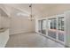 Dining room featuring a chandelier and sliding glass door access to an outdoor patio at 3449 Yonge Ave, Sarasota, FL 34235