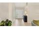 Inviting foyer with neutral tones, tiled floor and a view of the front door at 3449 Yonge Ave, Sarasota, FL 34235