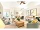 Bright living room with vaulted ceilings, tile flooring, and comfortable seating at 3449 Yonge Ave, Sarasota, FL 34235