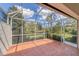 Large screened patio overlooks a beautiful pond, providing a tranquil outdoor living space at 3449 Yonge Ave, Sarasota, FL 34235