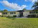 Expansive backyard featuring a patio with outdoor furniture and a well-maintained lawn at 390 301 W Blvd # 5B, Bradenton, FL 34205
