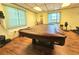 Spacious game room featuring a covered pool table, providing a recreational area for entertainment and leisure at 390 301 W Blvd # 5B, Bradenton, FL 34205