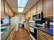 Functional kitchen with appliances and ample cabinet space for storage at 390 301 W Blvd # 5B, Bradenton, FL 34205