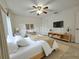 Cozy bedroom featuring a comfortable bed, modern furnishings, and ample natural light at 390 301 W Blvd # 5B, Bradenton, FL 34205