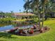 Scenic view of a serene pond surrounded by lush landscaping, offering a peaceful and picturesque setting at 390 301 W Blvd # 5B, Bradenton, FL 34205