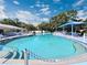 Community pool area featuring ample seating, shade, and a clean, inviting pool at 390 301 W Blvd # 5B, Bradenton, FL 34205