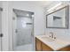 Modern bathroom featuring glass enclosed shower, stylish vanity, and chic finishes at 3931 Bay Shore Rd, Sarasota, FL 34234
