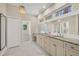 Spacious bathroom with double vanity, marble floors, and large mirror at 3931 Bay Shore Rd, Sarasota, FL 34234