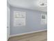 This bedroom features plantation shutters and a modern ceiling fan at 3931 Bay Shore Rd, Sarasota, FL 34234