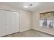 Bright bedroom features a closet and modern lighting fixture at 3931 Bay Shore Rd, Sarasota, FL 34234