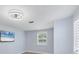 A well-lit bedroom is illuminated by modern ceiling fan and natural light at 3931 Bay Shore Rd, Sarasota, FL 34234