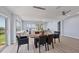 Open concept dining room offers plenty of natural light and views of the waterfront at 3931 Bay Shore Rd, Sarasota, FL 34234