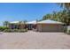Beautiful home featuring a brick driveway, seahorse window accents, and a convenient two-car garage at 3931 Bay Shore Rd, Sarasota, FL 34234