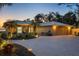 Charming home featuring a brick driveway, seahorse window accents, and a convenient two-car garage at 3931 Bay Shore Rd, Sarasota, FL 34234