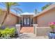 Welcoming front entrance with a beautiful brick walkway, double doors, and decorative planters at 3931 Bay Shore Rd, Sarasota, FL 34234