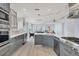 Gourmet kitchen overlooking the waterfront featuring stainless appliances, wine cooler and custom cabinets at 3931 Bay Shore Rd, Sarasota, FL 34234