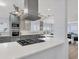 Well-appointed kitchen with stainless steel vent hood and sleek white countertops at 3931 Bay Shore Rd, Sarasota, FL 34234