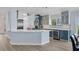 Spacious kitchen boasting stainless steel appliances, custom cabinetry, and large island perfect for entertaining at 3931 Bay Shore Rd, Sarasota, FL 34234