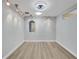 Bright living room boasts recessed lights, light-colored wood flooring, and a unique archway detail at 3931 Bay Shore Rd, Sarasota, FL 34234